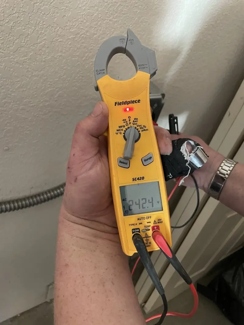 Voltage testing with clamp meter during Generator Installation in Winters